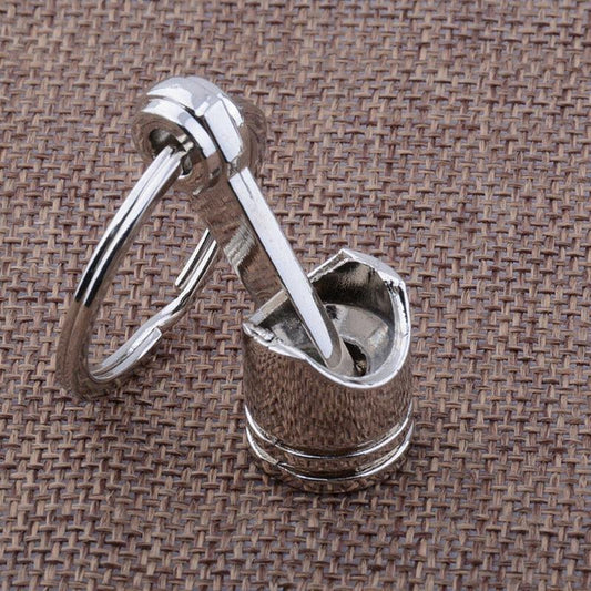 Porte clé Piston sur tissu