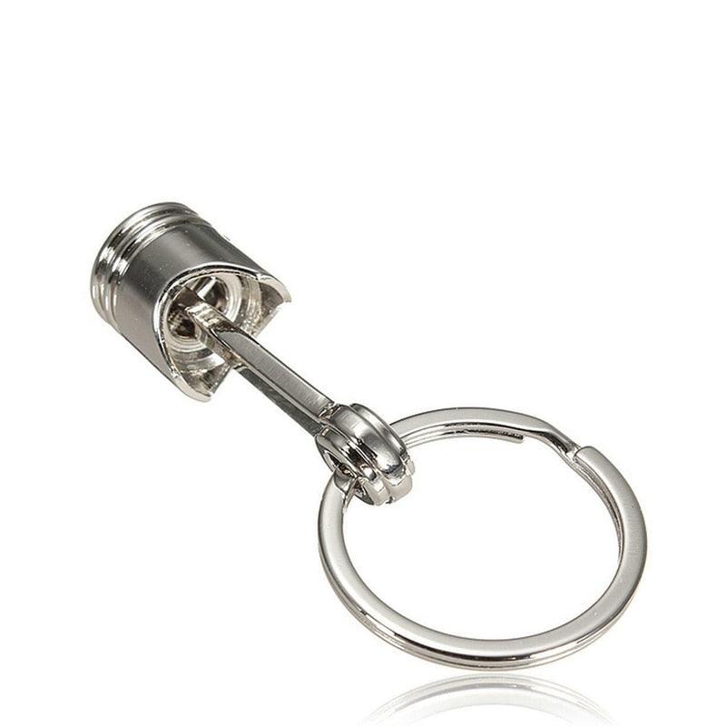 Porte clé Piston fond blanc